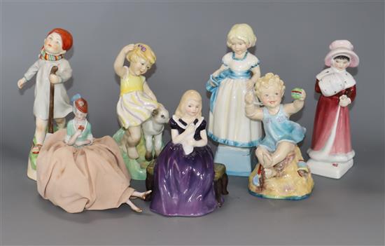 A collection of Royal Worcester figurines, two Doulton figures and a pin dolly